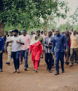 Community members and leaders walking during the KESU environmental initiative