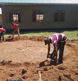 Workers laying foundation